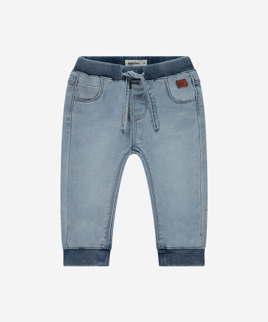 Details: These light blue denim baby jogg jeans are designed with an elastic waistband for ultimate comfort for your little one. Made with high-quality denim, these jeans are perfect for everyday wear. Expertly crafted for maximum flexibility and style.  Color: Light blue denim  Composition: 76% cotton/22% polyester/2% elasthan  