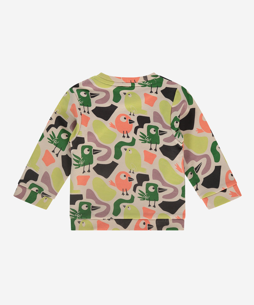 Details:  This fashionable baby sweatshirt is made with an all over print colorfull birds, a round neckline, ribbed arm cuffs and waistband, and push buttons on the side for easy opening. Perfect for any little one, this sweatshirt provides both comfort and style.  Color: Cream  Composition:  95% BCI cotton/5% elasthan  