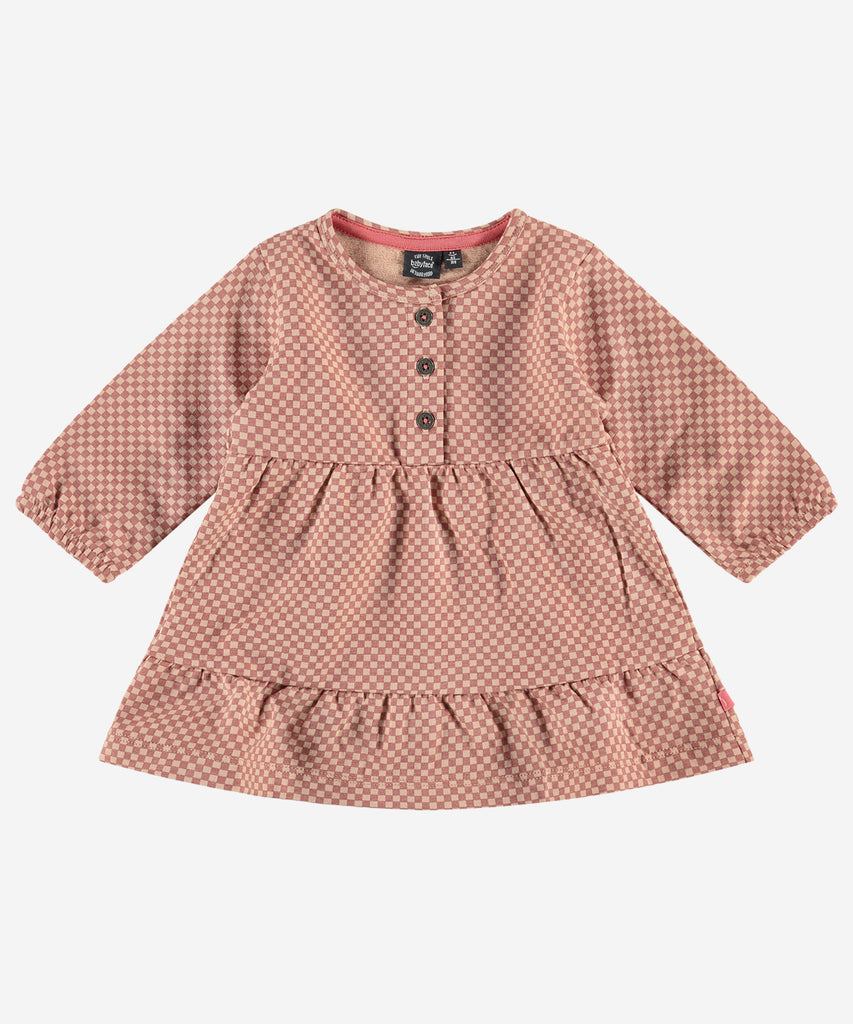 Details:  This baby dress features a stunning all-over check pattern with buttons for an extra touch of style. Crafted from premium fabrics, this dress will ensure your little one looks cute, feels comfortable, and stands out in a crowd. Round Neckline.  Color: Blush melange  Composition:   95% BCI cotton/5% elasthan  