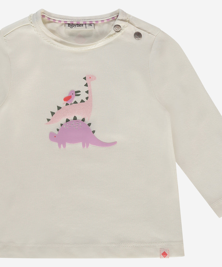 Details: This baby girl's long sleeve t-shirt features a round neckline and buttons on the side for easy dressing. The adorable stacking dinos print on the front adds a playful touch to this cozy ivory shirt. Perfect for keeping your little one comfortable and stylish.  Color: Ivory  Composition:   95% BCI cotton/5% elasthan  