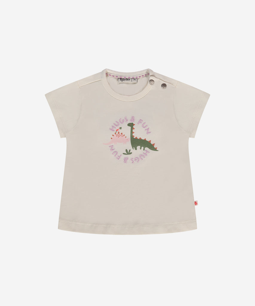 Details: This baby t-shirt features a cute Dino print on the front, perfect for your little one's warm-weather adventures. Made with a cozy round neckline and short sleeves, it offers comfort and style for your baby's daily wear. Buttons on the side for easy dressing.  Color: Ivory  Composition:  95% cotton/5% elasthan  