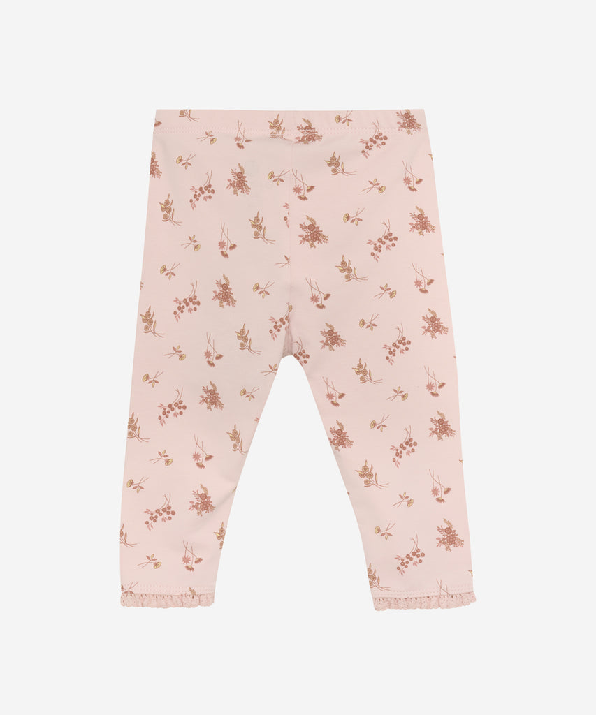 Details: Enhance your baby's wardrobe with our AOP flower print leggings. Made with an elastic waistband for maximum comfort, these leggings are perfect for any occasion. Boost your child's style and comfort with these adorable and versatile leggings.  Color: Peach whip  Composition:  Organic Single Jersey 95% Cotton/ 5% Elastane  