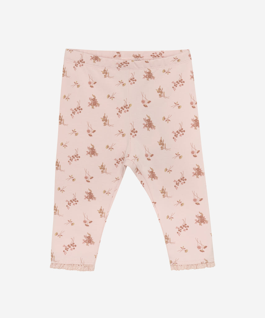 Details: Enhance your baby's wardrobe with our AOP flower print leggings. Made with an elastic waistband for maximum comfort, these leggings are perfect for any occasion. Boost your child's style and comfort with these adorable and versatile leggings.  Color: Peach whip  Composition:  Organic Single Jersey 95% Cotton/ 5% Elastane  
