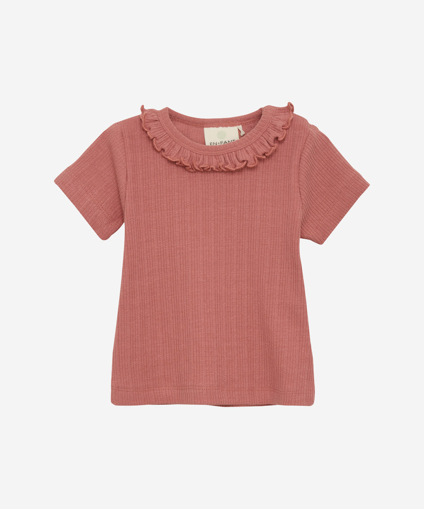 Details:  This short sleeve baby t-shirt features a ribbed texture and a nice collar for a versatile and comfortable style. With a round neckline, it's perfect for daily wear and easy to mix and match with other pieces. Upgrade your little one's wardrobe with this old rose colored t-shirt.   Color: Old rose  Composition:  Organic Rib 95% Cotton/ 5% Elastane  