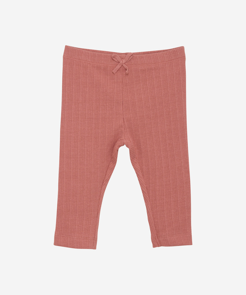 Details: Enhance your baby's wardrobe with our ribbed leggings. Made with an elastic waistband for maximum comfort, these leggings are perfect for any occasion. Boost your child's style and comfort with these adorable and versatile leggings.  Color: Old rose  Composition:  Organic Rib 95% Cotton/ 5% Elastane  