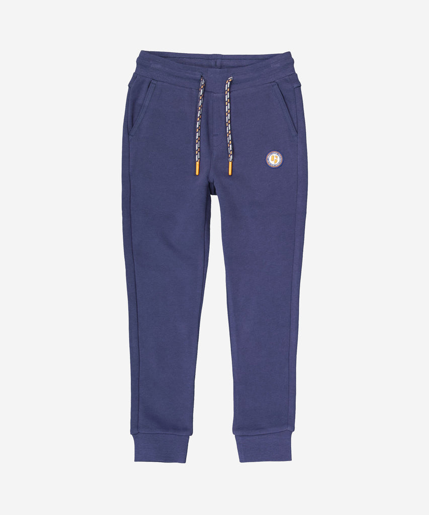 Details: Featuring a sleek, whale blue design, our Jogg Pants provide a comfortable and stylish option for your active lifestyle. Made with an elastic waistband, contrasting drawstring  and leg cuffs, these jogging pants offer a snug fit while allowing for ease of movement. Perfect for any workout or casual outing, these pants are a must-have for any wardrobe.  Color: Whale blue   Composition:  80% Cotton, 20% Polyester  