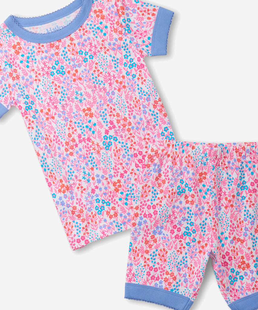 Details:  Nothing will keep them cooler on those warm summer nights than this cozy Pyjama set! Featuring short sleeves, a short pant, all over print doodle and crafted from organic cotton, these are sure to make summer sleep a breeze.  Color: Pink  Composition:  100% Organic Cotton  