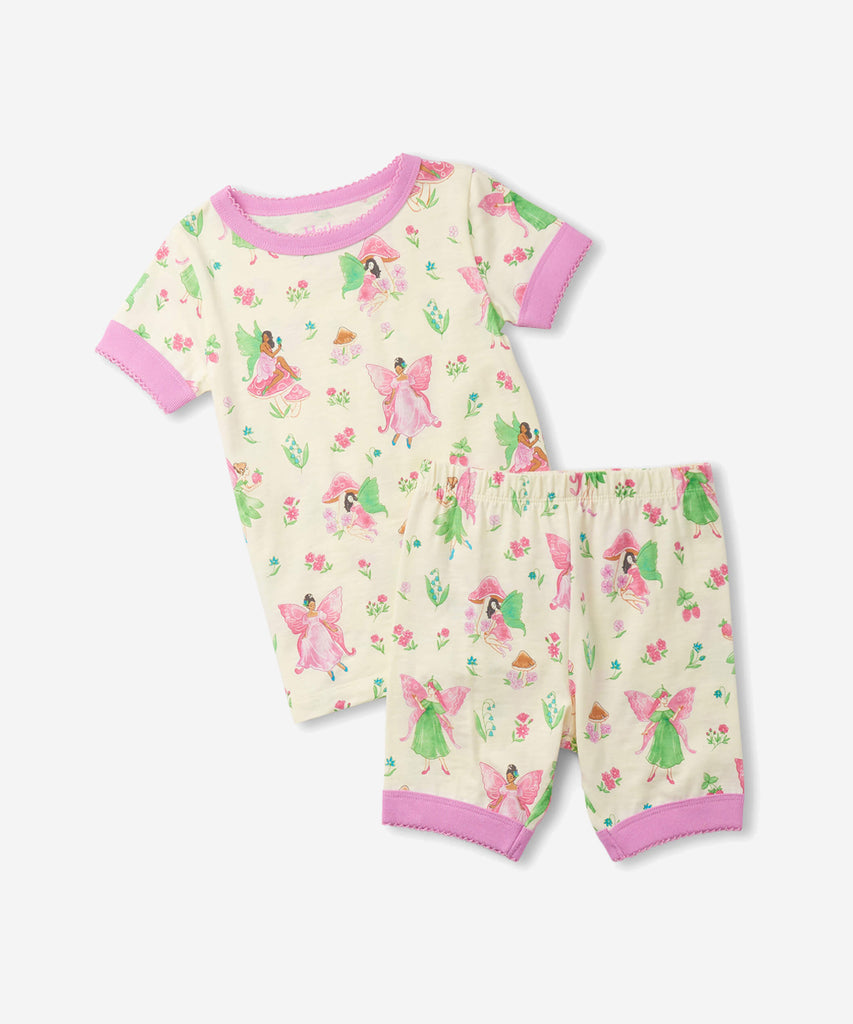 Details:  Nothing will keep them cooler on those warm summer nights than this cozy Pyjama set! Featuring short sleeves, a short pant, all over print doodle and crafted from organic cotton, these are sure to make summer sleep a breeze.  Color: Cream pink  Composition:  100% Organic Cotton  