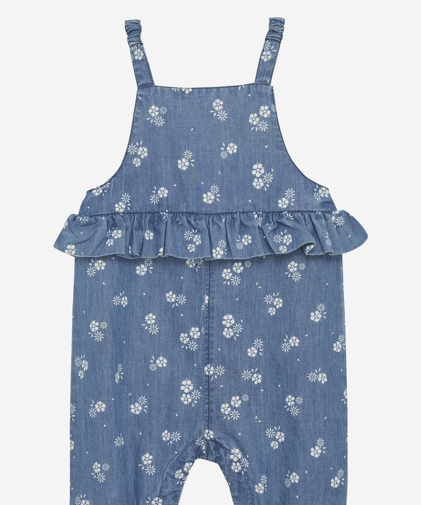 Details: Effortlessly dress up your little one in our Chambray Baby Overall! Made with soft, lightweight chambray and adorned with lovely floral prints, this overall features convenient push buttons for easy dressing. The frills add a charming touch, making it the perfect outfit for any occasion.   Color: Gray mist   Composition:  Organic Chambray 100% Cotton  