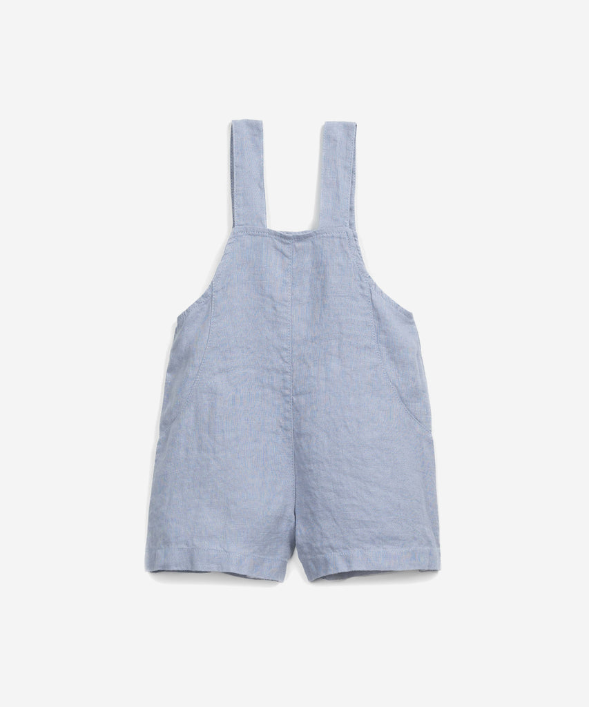 Details: This jumpsuit is made of woven linen, Albufeira blue colour. It has adjustable straps, a square neck, a front opening with coconut buttons and a breast pocket. Colour: Blue  Composition:  100.0% Linen  