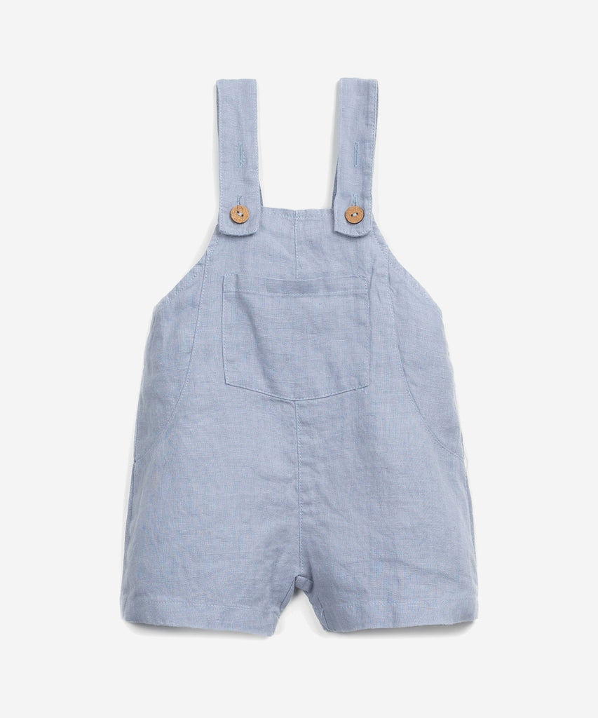 Details: This jumpsuit is made of woven linen, Albufeira blue colour. It has adjustable straps, a square neck, a front opening with coconut buttons and a breast pocket. Colour: Blue  Composition:  100.0% Linen  