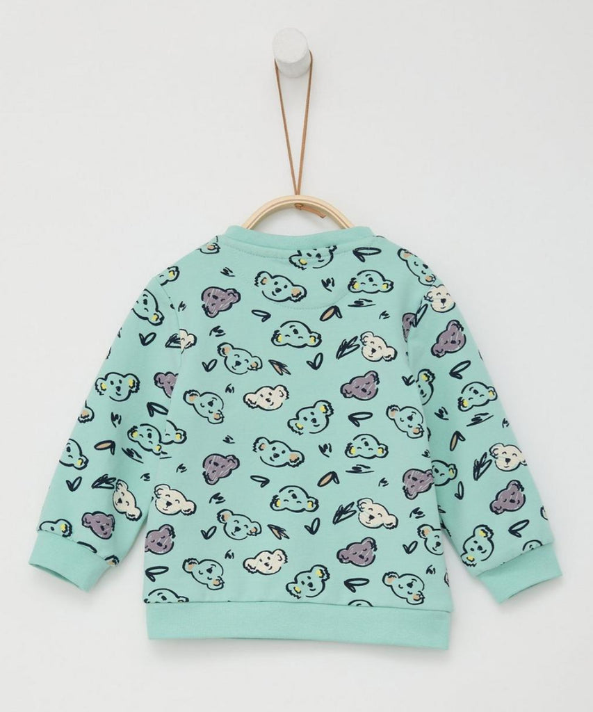 Details: Introduce your little one to cozy comfort with our Baby Sweatshirt AOP Koala Mint. Crafted in mint green with an all over print of adorable koalas, our sweatshirt features a round neckline and ribbed arm cuffs and waistband for a snug fit. Keep your baby stylish all day long.  Color: Mint  Composition: 095%CO 005%EL   