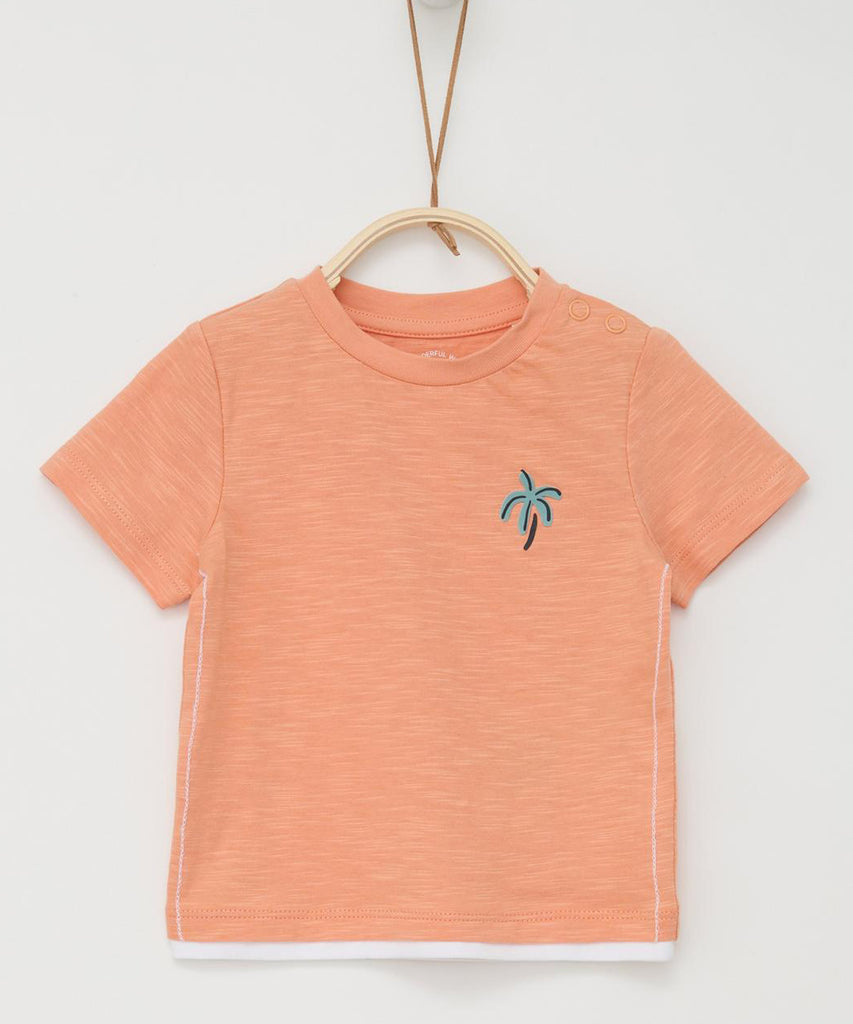 <strong>Details: </strong>This short sleeved baby t-shirt features a palm tree design in a soft orange melee color. The round neckline and pushbuttons on the side of the collar make dressing easy. Keep your little one comfortable and stylish in this must-have t-shirt.&nbsp;<br><strong></strong><strong></strong><strong>Color:</strong><span> Soft orange melee&nbsp;</span><br><strong>Composition: </strong> 100%CO <strong> </strong><span>&nbsp;&nbsp;</span>