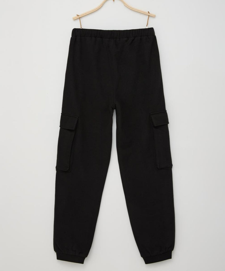 Details:  Expertly designed for ultimate comfort and practicality, these loose fit cargo pants in black are a must-have for any wardrobe. The elastic waistband and adjustable elastic on the inside ensure a perfect fit, while the multiple pockets provide ample storage space. Elevate your style and efficiency with these versatile cargo pants.  Color:﻿ Black  Composition:  090%CO 010%PES