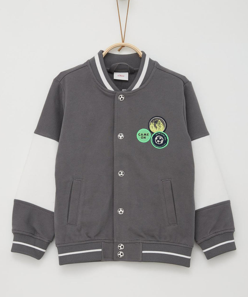 <strong data-mce-fragment="1">Details:&nbsp; </strong>Elevate your little one's style with our Bomber Cardigan in Mid Grey. This boys' cardigan features convenient pockets and a push button closure. Make a statement with the bold "Future Leader" text on the back. Perfect for fashion-forward kids who are destined for greatness.&nbsp;<br><strong data-mce-fragment="1"></strong><strong>Color:</strong> Mid grey&nbsp;<br><strong>Composition:</strong> 090%CO 010%PES &nbsp;