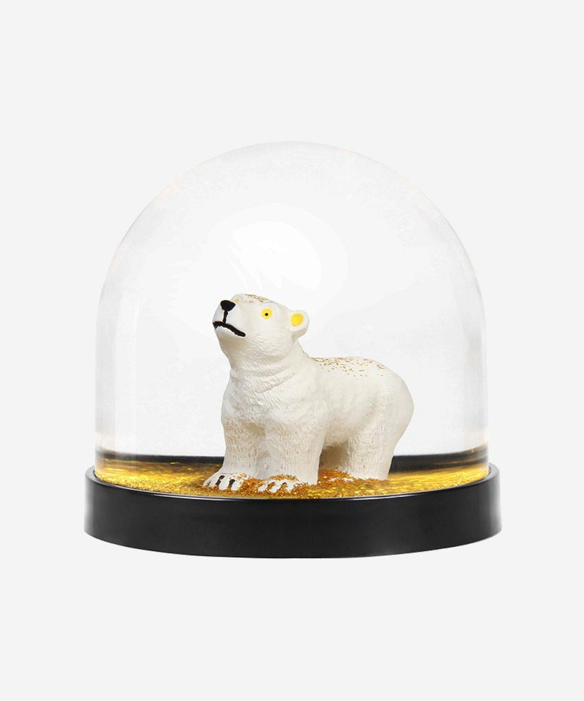 Shake the wonder ball and golden glitters will spread in the ball and slowly will fall down on the white polar bear. The ball is in plastic and mineral oil, the base is black. The wonder ball's size is 8 x Ø 8,5 cm.