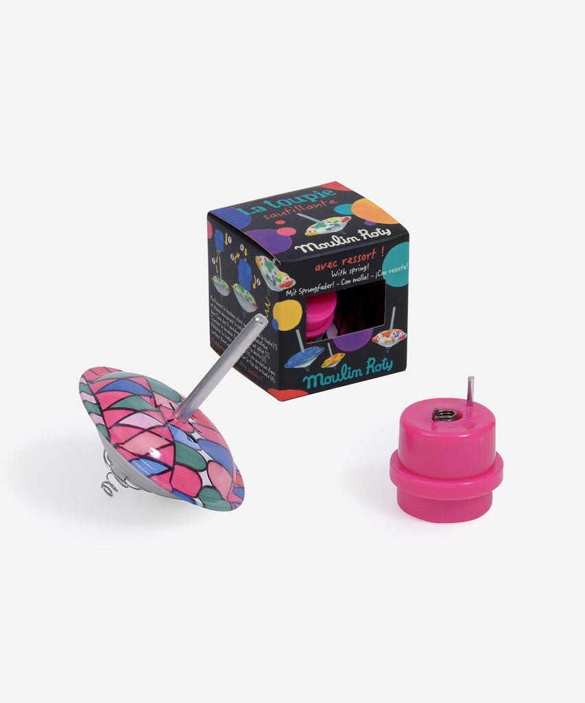 MOULIN ROTY  This spinning top has a built-in spring so it spins and bounces at the same time!  Collection's history Les Petites Merveilles... Little nothings for big play; invent a thousand and one different marvels …  Age: 3+ Color: multi pink Size: 6cm Composition: metal & plastic