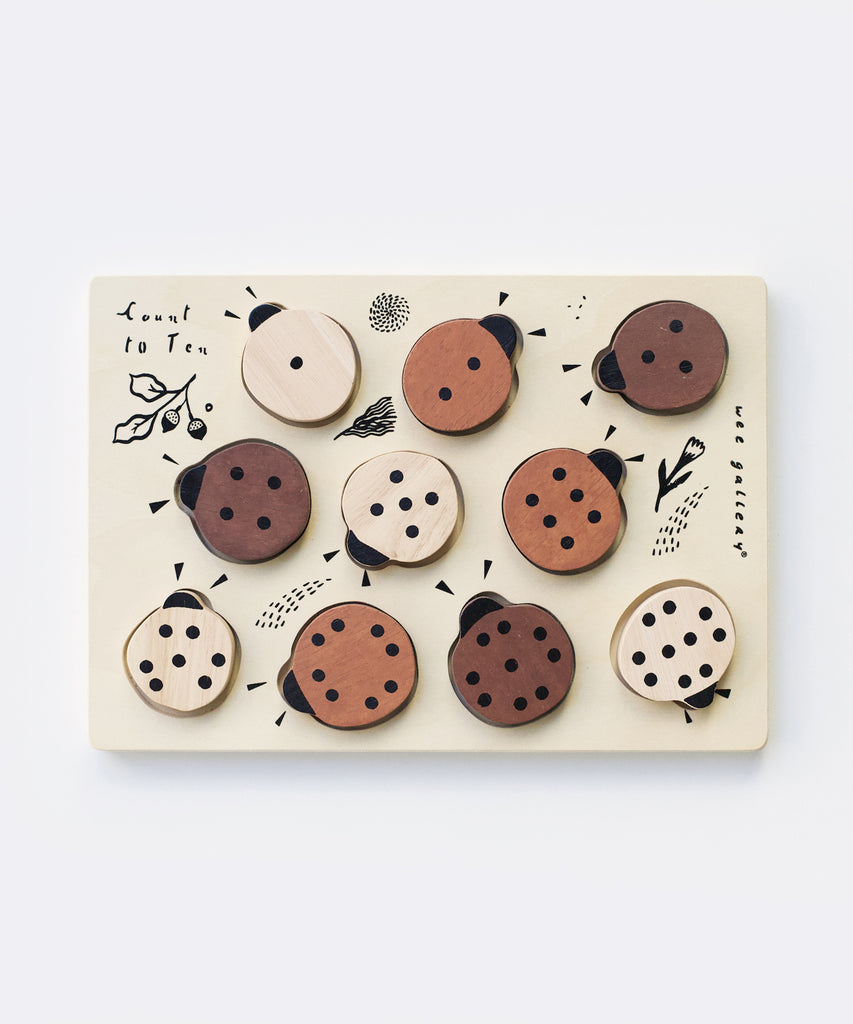 Wee Gallery  This beautiful wooden puzzle is a fun and challenging way to explore numbers! As counting skills improve, children will be able to solve the puzzle by matching the numbers to the dots on the ladybugs.  