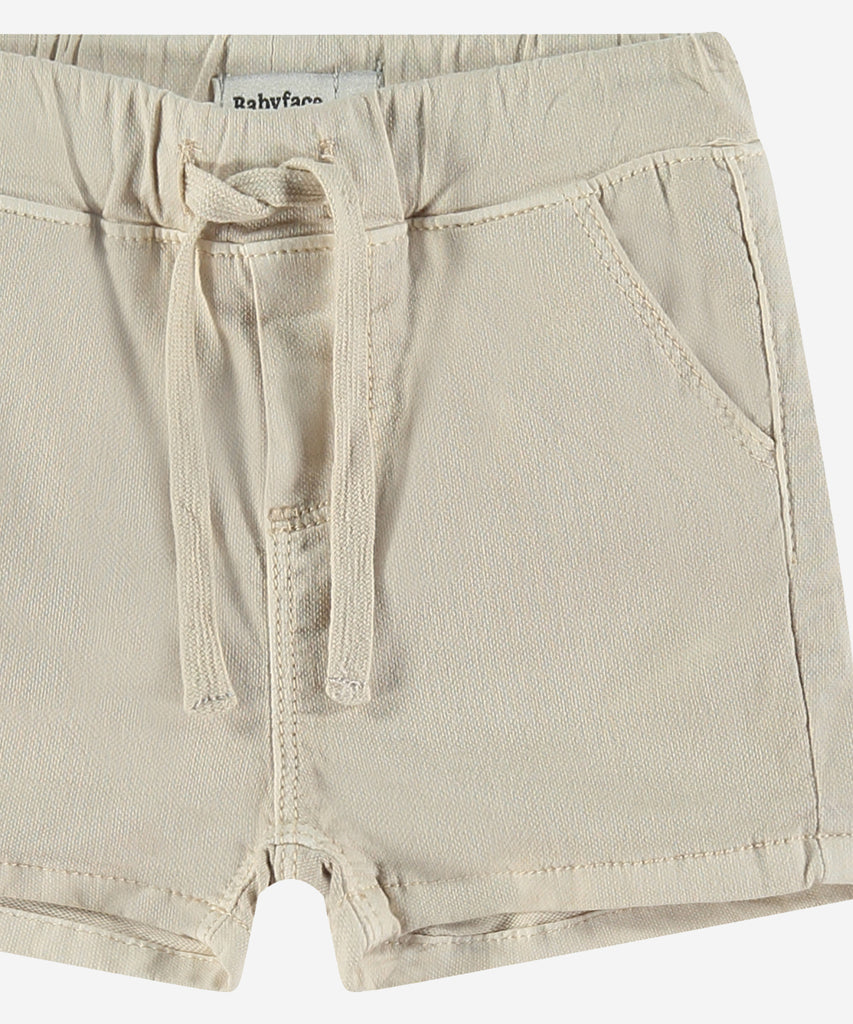 <strong>Details: </strong>These lightweight woven shorts are perfect for your little one. With an elastic waistband and convenient pockets, your baby will stay comfortable and stylish all day. Made with high-quality materials for long-lasting wear. Perfect for any adventure!&nbsp;<br><strong>Color</strong>: Stone&nbsp;<br><strong>Composition</strong>: Summer 24 &nbsp;