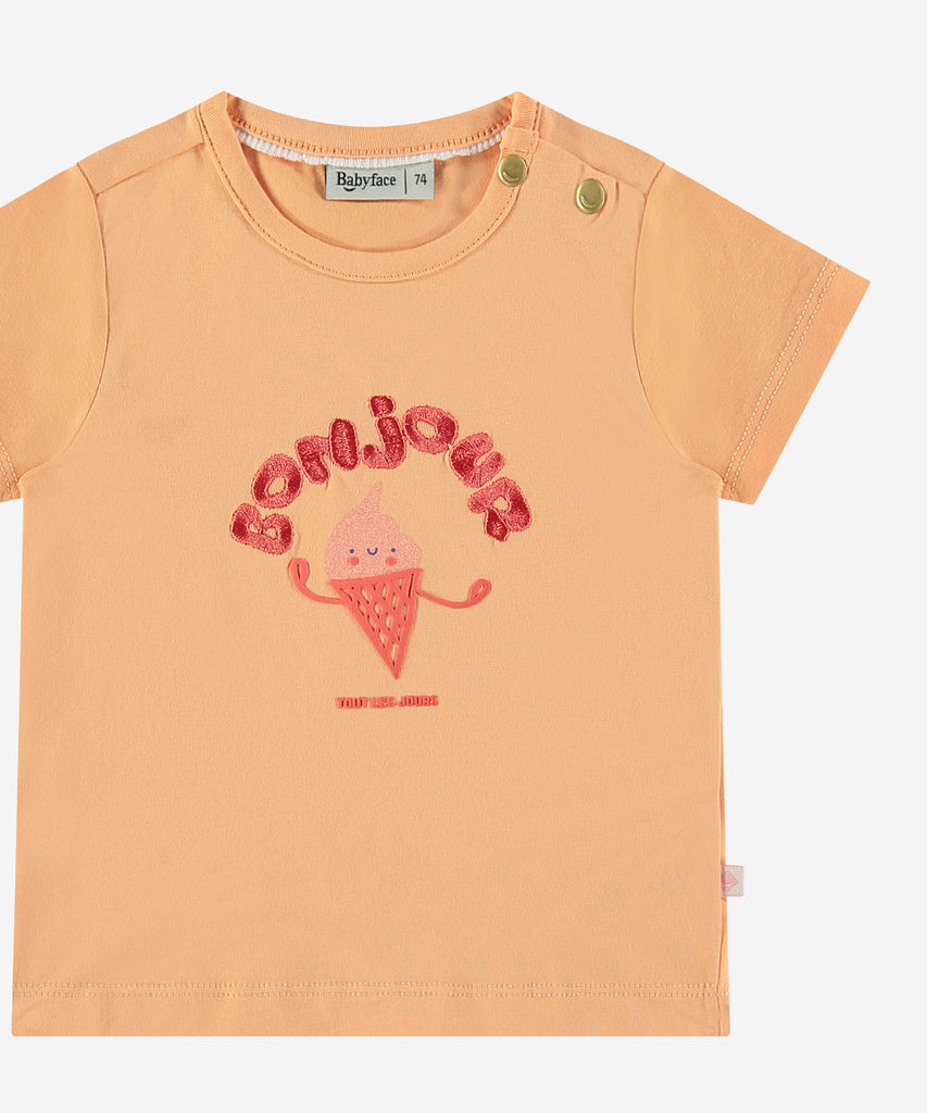 <strong>Details: </strong>This baby t-shirt features a charming bonjour ice cream print on the front, adding a touch of sweetness to any outfit. The rounded neckline provides comfort and ease for your little one. Give your baby a cute and stylish look with this bonjour cantaloupe t-shirt. Buttons on the side for easy dressing.&nbsp;&nbsp;<br><strong>Color</strong>: Cantaloupe<br><strong>Composition</strong>: &nbsp;95% cotton/5% elasthan &nbsp;