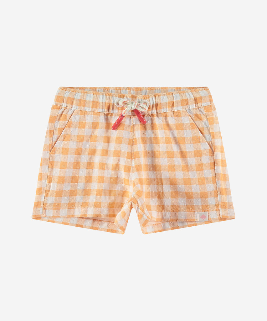 <strong>Details: </strong>These baby woven vichy shorts in cantaloupe are both comfortable and stylish. The elastic waistband ensures a perfect fit, while the woven vichy fabric adds a touch of sophistication. Perfect for any occasion, these shorts are a must-have for any little one's wardrobe.&nbsp;<br><strong></strong><strong></strong><strong></strong><strong>Color</strong>: Cantaloupe&nbsp;<br><strong>Composition</strong>: Summer 24 &nbsp;