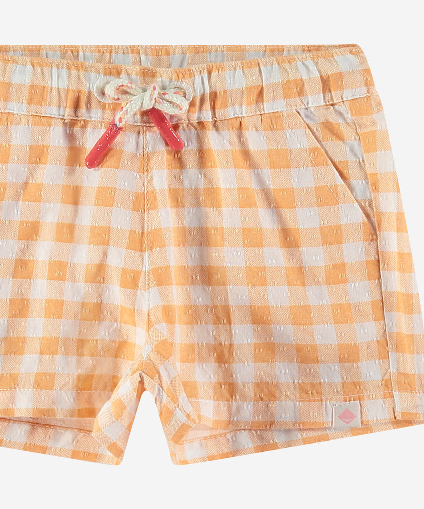 <strong>Details: </strong>These baby woven vichy shorts in cantaloupe are both comfortable and stylish. The elastic waistband ensures a perfect fit, while the woven vichy fabric adds a touch of sophistication. Perfect for any occasion, these shorts are a must-have for any little one's wardrobe.&nbsp;<br><strong></strong><strong></strong><strong></strong><strong>Color</strong>: Cantaloupe&nbsp;<br><strong>Composition</strong>: Summer 24 &nbsp;