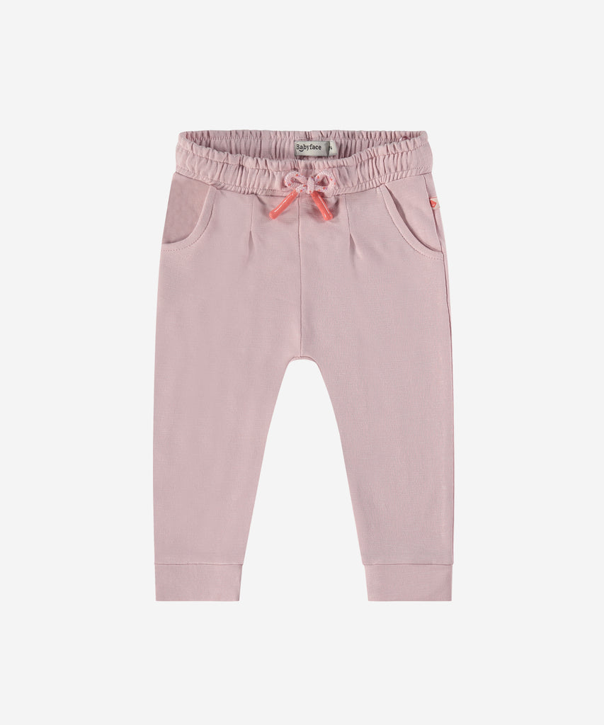 Details:  Introducing the soft Jogg Sweat Pants, designed for your little one's comfort. Crafted from a soft and durable fabric, these pants feature an elastic waistband for a secure and comfortable fit.  Ensure your child's adventures are as comfortable as can be with these Jogging Pants.  Color: Blush  Composition: 95% BCI cotton/5% elasthan  