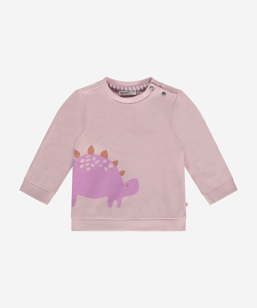 Details:  This fashionable baby sweatshirt is made with a cute dino print, a round neckline, ribbed arm cuffs and waistband, and push buttons on the side for easy opening. Perfect for any little one, this sweatshirt provides both comfort and style.  Color: Blush  Composition:  95% BCI cotton/5% elasthan  