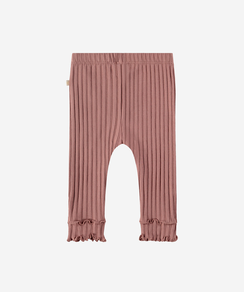 Details: "Made with soft ribbed fabric, our Baby Rib Leggings Blossom provide comfort and flexibility for your little one. The elastic waistband ensures a secure fit, while the frill detailing adds a playful touch. Perfect for everyday wear or special occasions."   Color: Blossom  Composition: 95% BCI cotton/5% elasthan  