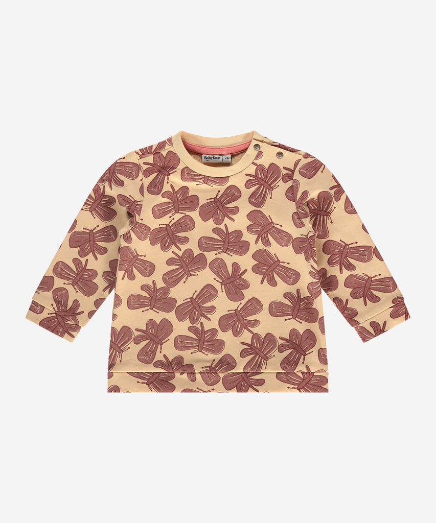 Details:  This fashionable baby sweatshirt is made with an all over print butterflies, a round neckline, ribbed arm cuffs, and push buttons on the side for easy opening. Perfect for any little one, this sweatshirt provides both comfort and style.  Color: Vanilla  Composition:  95% BCI cotton/5% elasthan  