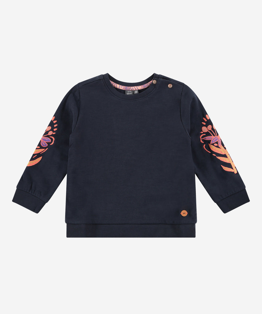 This stylish sweatshirt is perfect for young girls. With its beautiful embroidered flowers on the sleeves, it is sure to be a favorite. Crafted with a comfortable blend of materials, it features a ribbed waistband and arm cuffs to provide a perfect fit. This sweatshirt is sure to become a favorite in any kid's closet. Up to size 92, easy opening with 2 push buttons on the back. Round Neckline.   Color: Dark blue  Composition: 95% BCI cotton/5% elasthan 