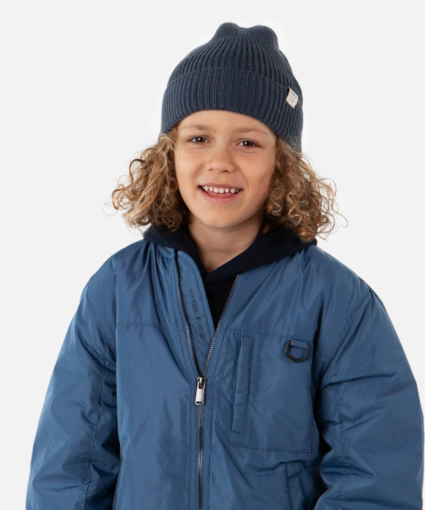 Details: The Wilco Beanie is a unisex soft knitted rib hat made of very stretchy and soft and warm material. Suitable for the entire season.  Color: Navy   Size:  50-53  = 1.5-4 years 53-55  = 4-8 years and up  Composition: 100% Polyester  