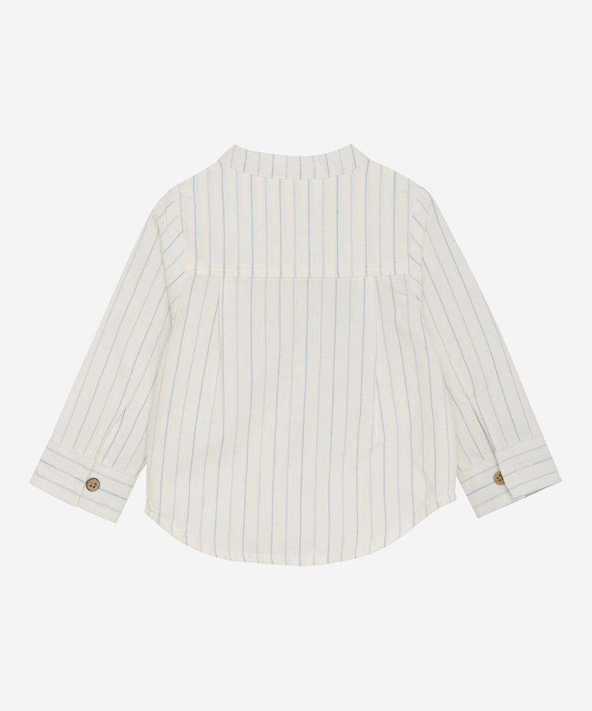 Details: This baby woven mao shirt in eggnog features a convenient pocket, classic stripes, and easy button closure. Made with soft and durable fabric, it provides comfort and style for your little one. Perfect for any occasion, this shirt is a must-have for any stylish baby's wardrobe.   Color: Eggnog  Composition: Organic Woven Yarndyed 100% Cott
