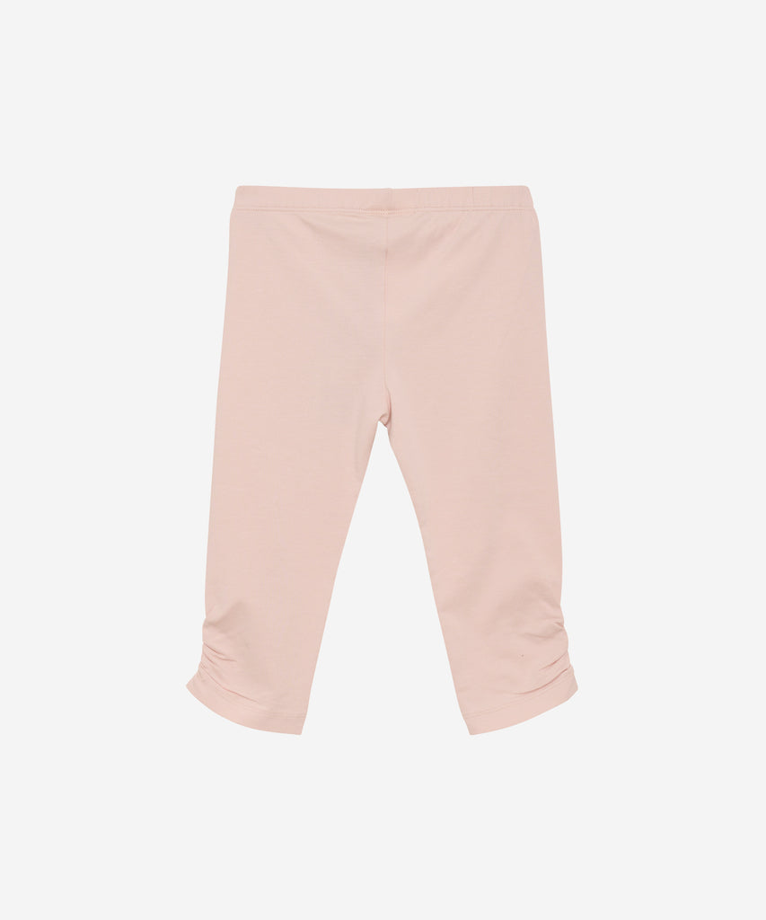 Details:  These 3/4 leggings in peach offer both comfort and style with its elastic waistband. Perfect for any activity, these leggings will keep you feeling supported and looking trendy.  Color: Peach whip  Composition:  Organic Single Jersey 95% Cotton/ 5% Elastane 