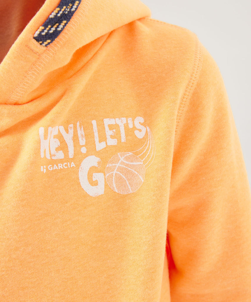 Details:  Stay stylish with our Hoodie Let's Go Neon Carrot. Made with a cozy hooded sweater and vibrant neon carrot color, this hoodie will make a statement wherever you go. The "let's go" print on the front adds a touch of motivation to your wardrobe. Plus, the ribbed arm cuffs and waistband provide a snug fit for ultimate comfort.   Color: Neon carrot  Composition: 65% Polyester, 35% Cotton 