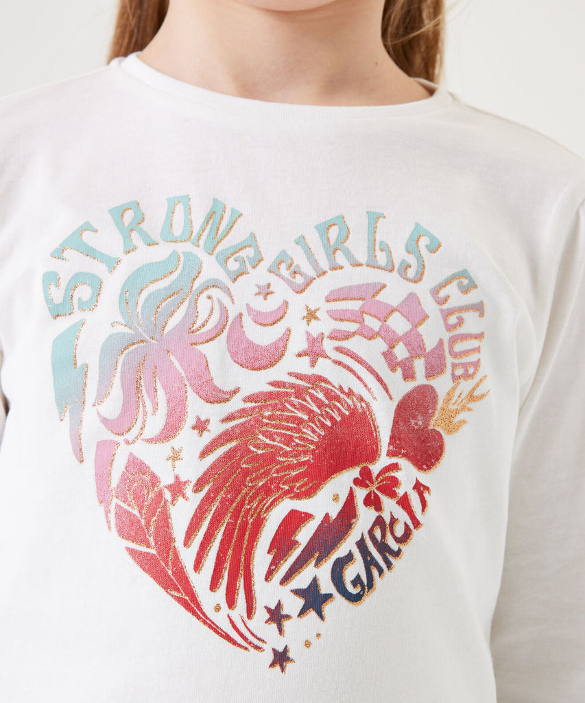 Details: &nbsp;Stay stylish and comfortable with our LS T-Shirt Heart in Off White. This long sleeve t-shirt features a round neckline and an adorable Heart print on the front. Perfect for everyday wear, add a touch of cuteness to your wardrobe. &nbsp;&nbsp; Color:&nbsp; Off white&nbsp; Composition:&nbsp; 100% Cotton&nbsp;
