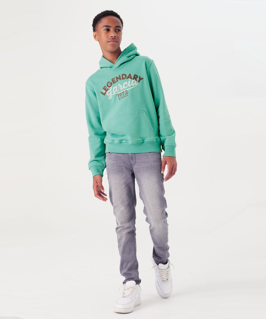 Details:  Stay cozy and stylish with our Legendary Sea Green Hoodie. Made with a kangaroo pouch for convenience and ribbed arm cuffs and waistband for a comfortable fit. The legendary print on the front adds a touch of uniqueness to this classic hooded sweater.  Color: Sea green   Composition:  80% Cotton, 20% Polyester  