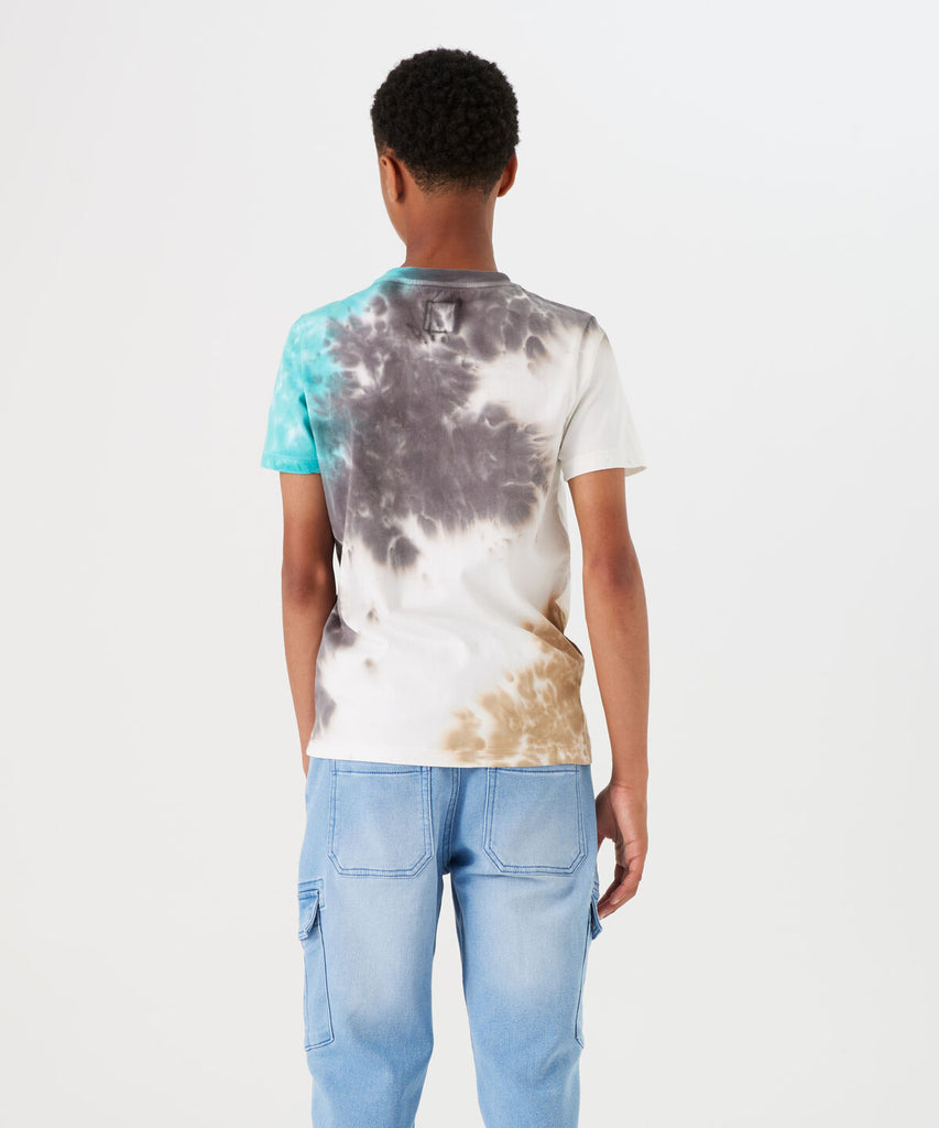 Details: Expertly crafted with a round neckline and short sleeves, this Spring Tie Dye Off White T-Shirt adds a unique touch to your wardrobe. The vibrant tie dye pattern is sure to make a statement, making it a great choice for casual outings or lounging at home.  Color:  Off White  Composition: 100% Cotton 