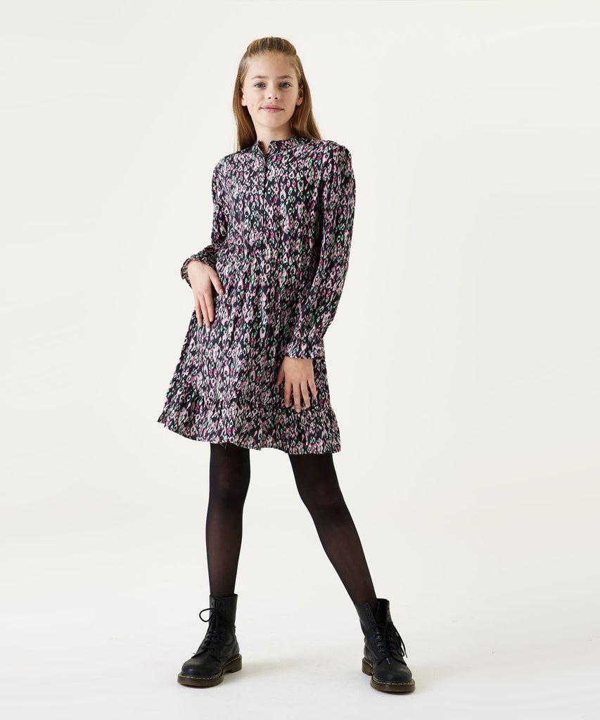 Details:  This high quality long sleeve Dress for teen girls is perfect for any occasion. Featuring a long sleeve design, all over print, and buttons on the front, this dress offers a perfect combination of style and comfort. The fabric is durable yet soft, ensuring an enjoyable day-to-day experience.  Color: Blue heather  Composition:  100% Viscose  