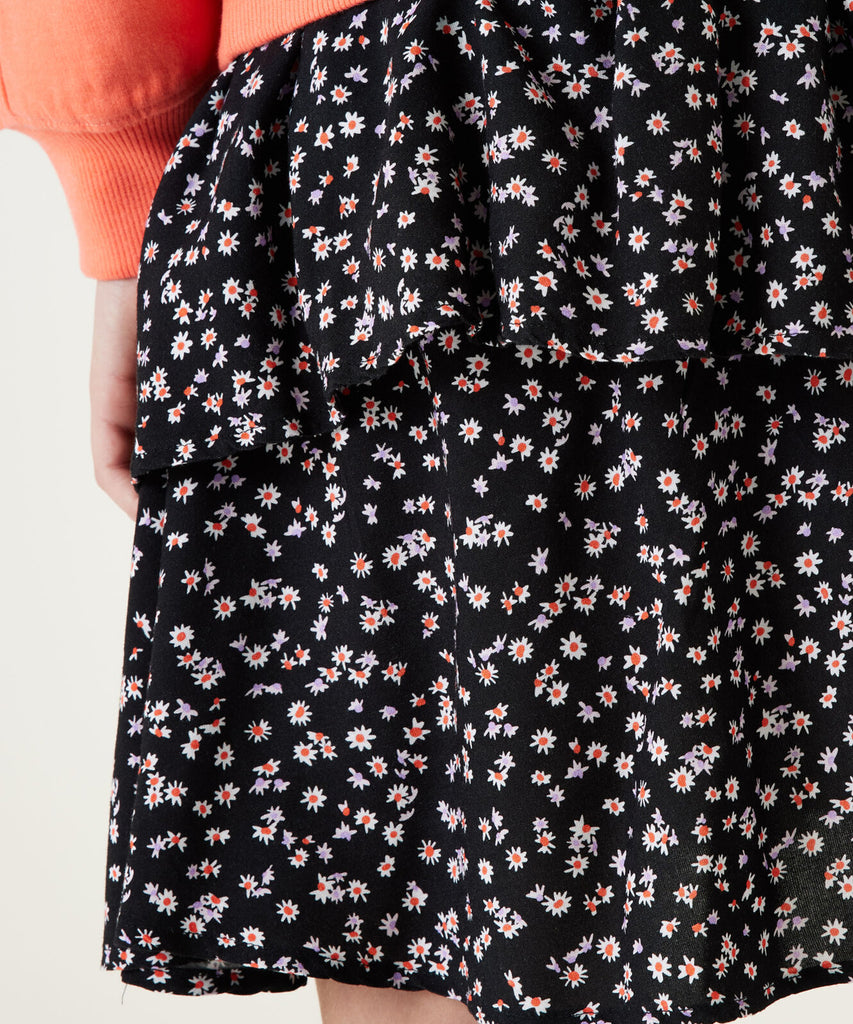 Details: Layered skirt with all over print daisies. Elastic waistband.  Color: Off black  Composition:  100% Viscose  