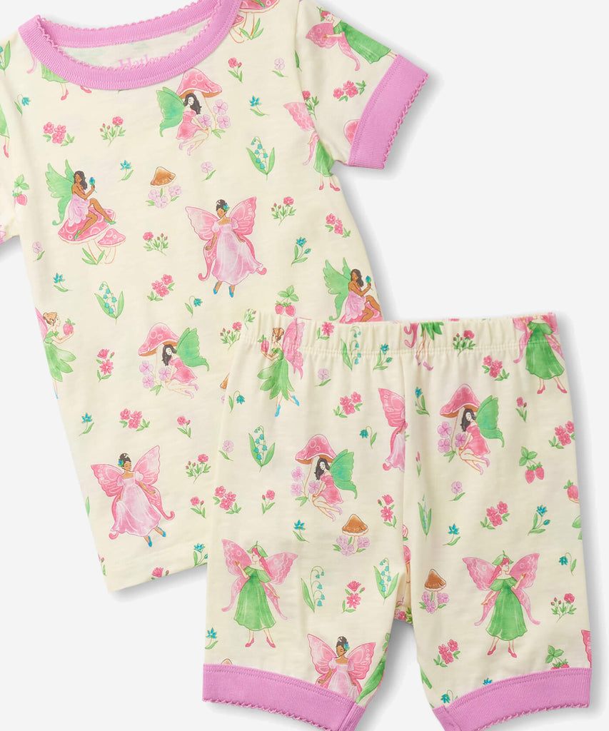 Details:  Nothing will keep them cooler on those warm summer nights than this cozy Pyjama set! Featuring short sleeves, a short pant, all over print doodle and crafted from organic cotton, these are sure to make summer sleep a breeze.  Color: Cream pink  Composition:  100% Organic Cotton  