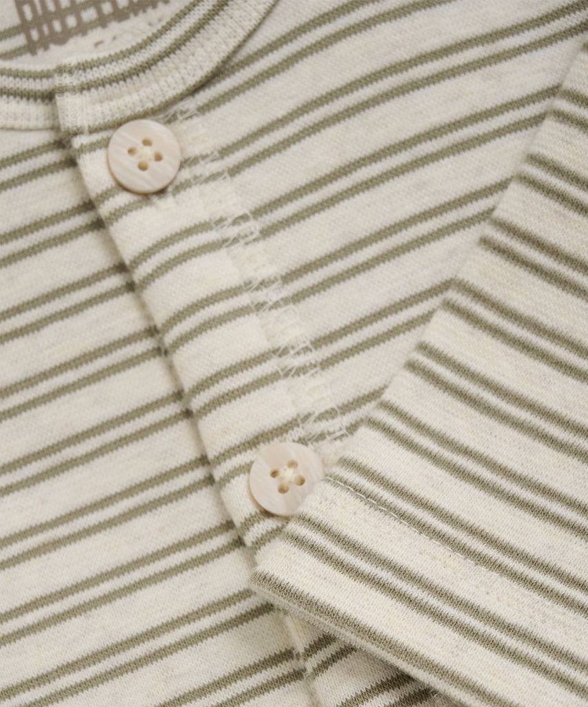 Details: This Silver Sage ribbed Baby Suit features double stripes, perfect for any little one. With long sleeves and a round neckline, this jumpsuit will keep your baby warm and comfy. The buttons make dressing and changing easy.  Color: Silver sage  Composition:  92% Cotton/ 5% Polyester/ 3% Elastane  