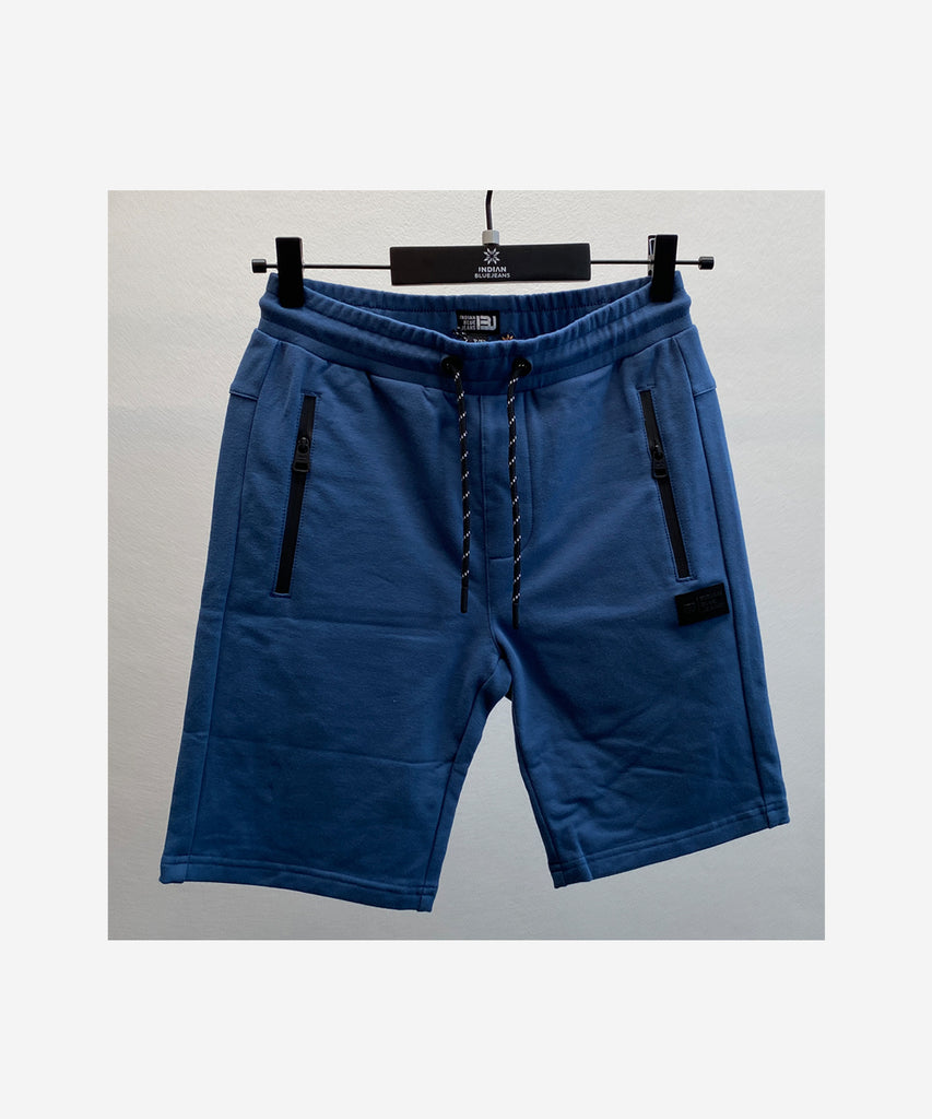 Details:  Upgrade your workout wardrobe with our Jogg Shorts Basic Zip in a sleek steel blue color. Featuring convenient zip pockets and an elastic waistband for comfort and practicality. Stay stylish and organized while you stay active.  Color: Steel blue  Composition:  Summer 2024  