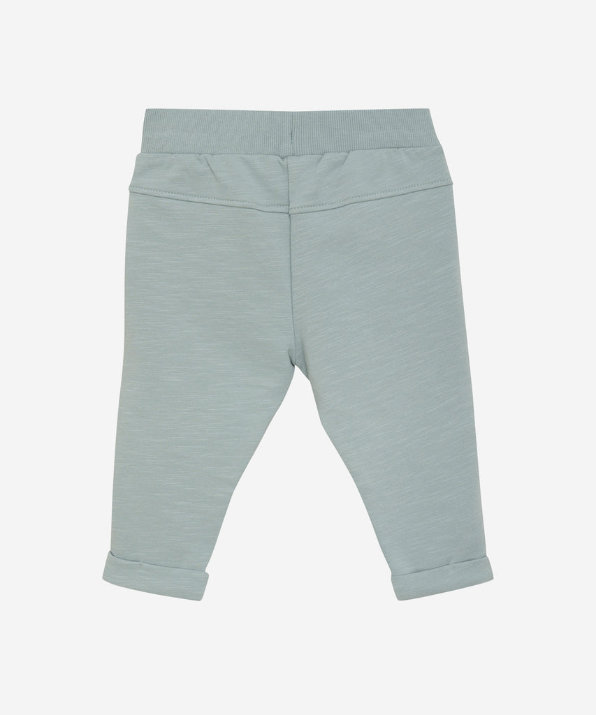 Details: These baby jogg pants are designed with comfort and style in mind. Soft and lightweight, each pair is equipped with an elastic waistband. Perfect for everyday wear.  Color: Abyss  Composition:  Organic Sweat-slub Yarn 95% Cotton/ 5% Elastane  