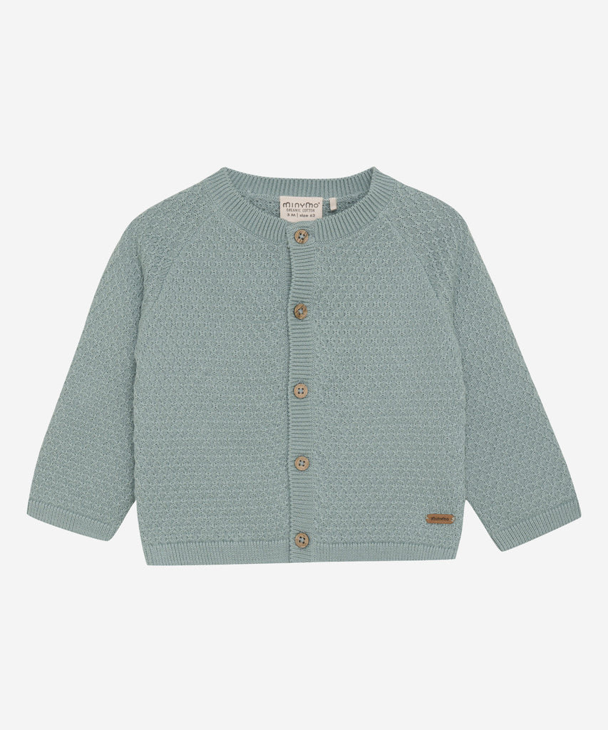 Details: This expertly-crafted Baby Knit Cardigan Abyss is made with a soft knitted fabric, perfect for your little one's delicate skin. The button closure adds convenience and security, while the classic design allows for easy pairing with any outfit. Keep your baby cozy and stylish with this essential piece. Round Neckline.  Color: Abyss  Composition:  Organic Knit 100% Cotton  