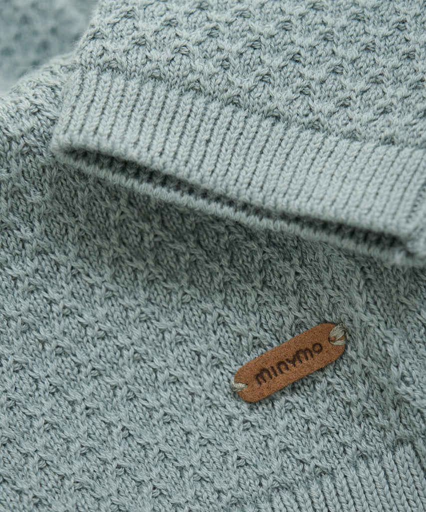 Details: This expertly-crafted Baby Knit Cardigan Abyss is made with a soft knitted fabric, perfect for your little one's delicate skin. The button closure adds convenience and security, while the classic design allows for easy pairing with any outfit. Keep your baby cozy and stylish with this essential piece. Round Neckline.  Color: Abyss  Composition:  Organic Knit 100% Cotton  