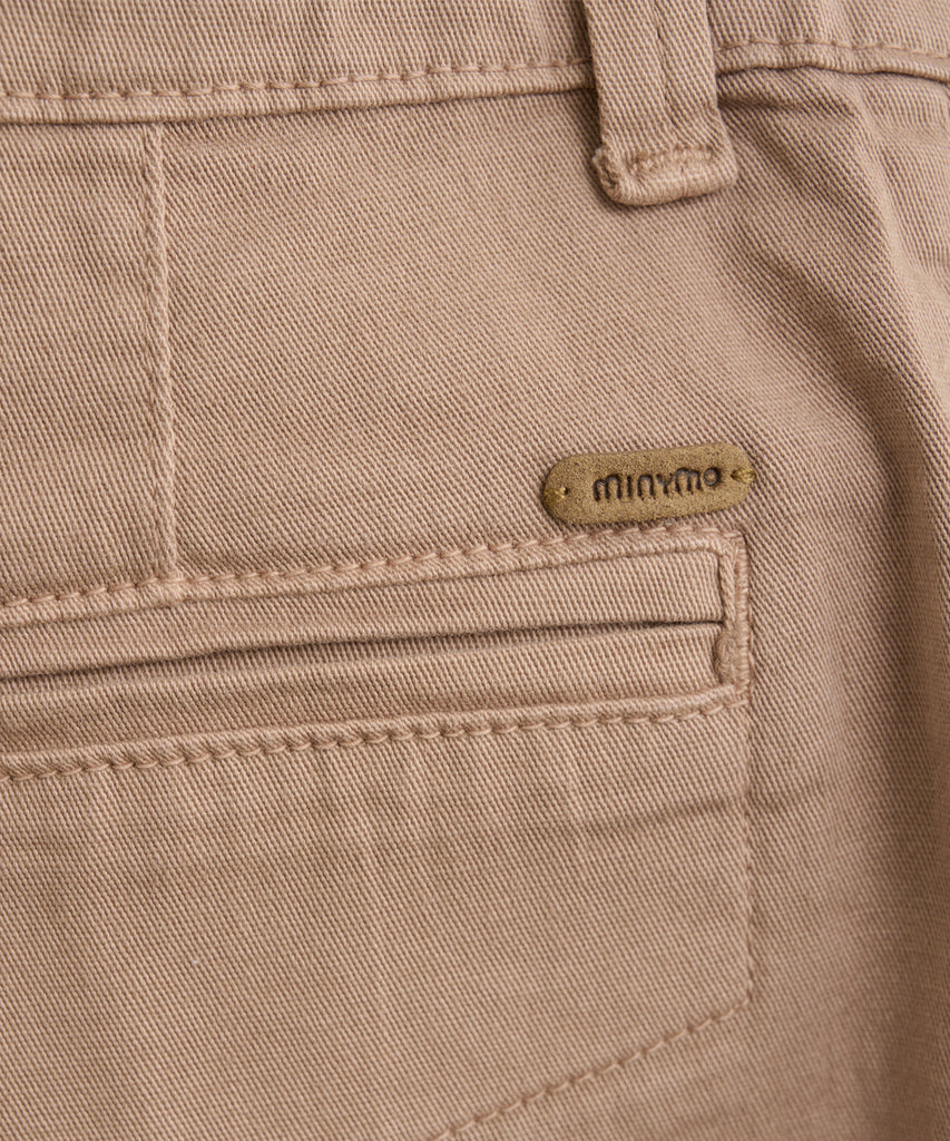 Details:  These Woven Twill Shorts Mocca Amphora are designed with a durable woven twill fabric and feature convenient pockets, belt loops for a customizable fit, and a secure zip and button closure. Stay stylish and comfortable in these versatile shorts.  Color: Mocca amphora  Composition:  TWILL 97% Cotton/ 3% Elastane  
