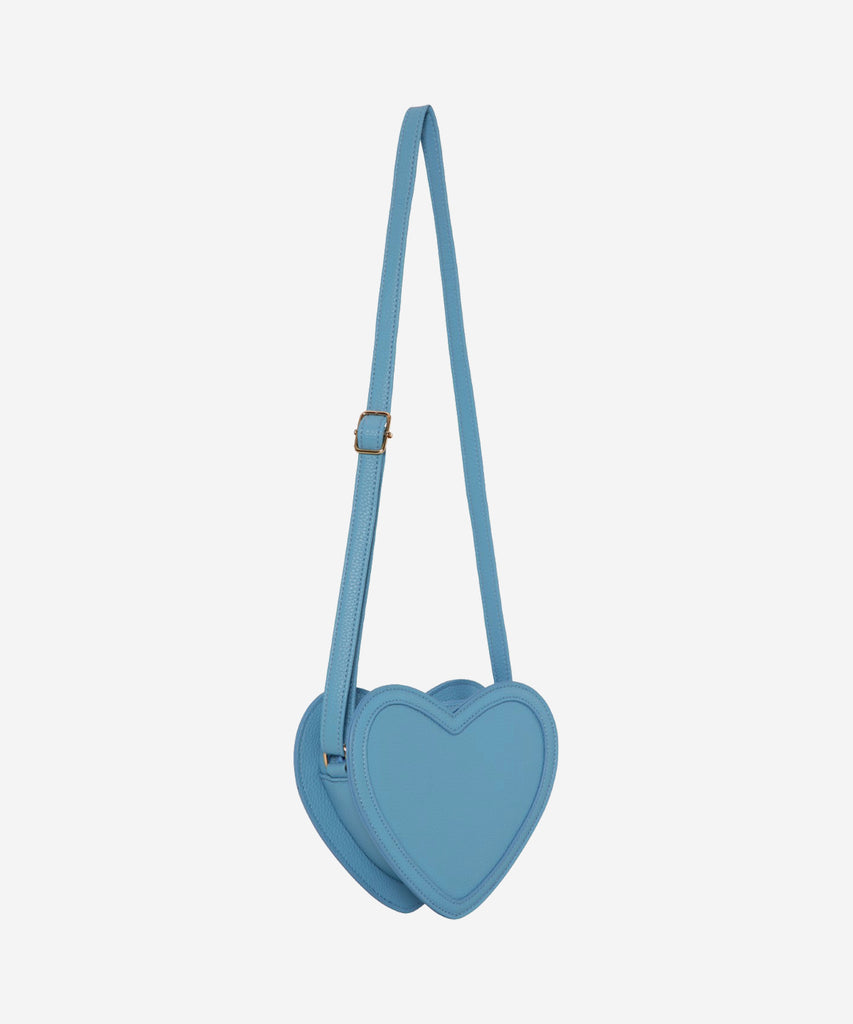 Details:  This bluesy little beauty will be sure to make a statement. The Heart Cross Body Bag Forget Me Not Blue is our sassiest accessory. With its heart-shaped silhouette and zipper closure, it's a perfect way to add a bit of flair to any look. Who could forget this dreamy blue bag?  Color: Blue  Composition:  100% Polyurethane 