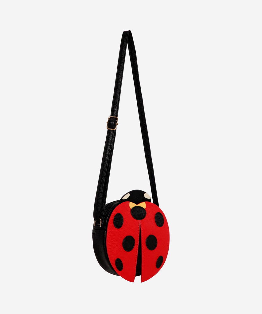 Details:  Our Ladybug Cross Body bag is the perfect companion for any adventure! This bag features an adorable ladybug design and zip closure to make sure your items are safe and secure. With this stylish bag, you're sure to be a hit no matter where your day takes you!  Color: Black red  Composition:  100% Polyurethane 