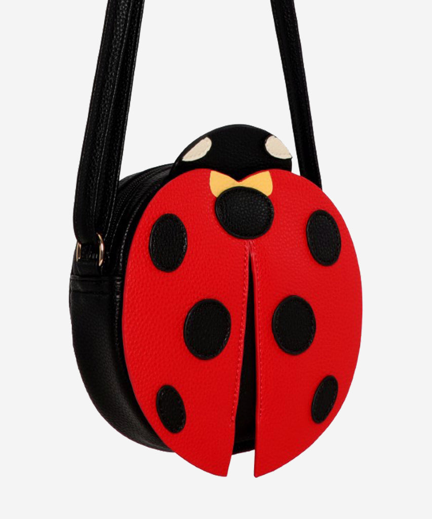 Details:  Our Ladybug Cross Body bag is the perfect companion for any adventure! This bag features an adorable ladybug design and zip closure to make sure your items are safe and secure. With this stylish bag, you're sure to be a hit no matter where your day takes you!  Color: Black red  Composition:  100% Polyurethane 